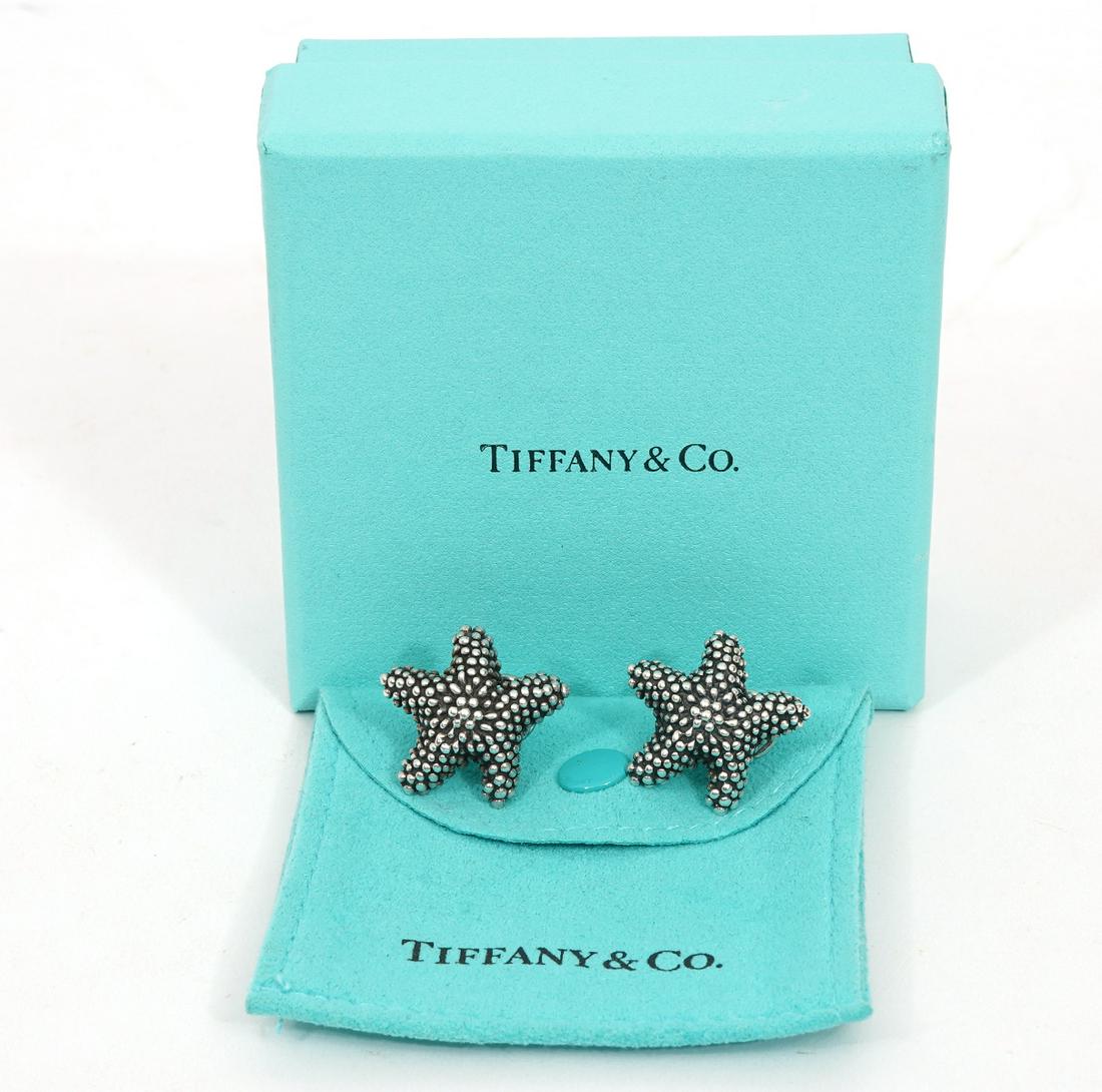 Tiffany Sterling Starfish Earrings Omega Backs: Tiffany & Co sterling silver starfish earrings with omega backs, includes original sleeve and box. Weight - 11.2g. Condition report: Good condition, no issues, please examine all photos closely. Conta