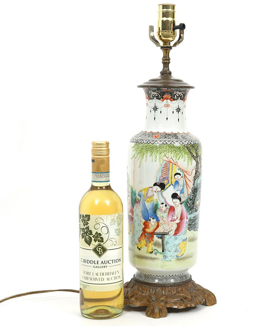 Chinese Hand-Painted Porcelain Vase Lamp: Chinese porcelain vase converted to lamp. Features painted motif of women and children in courtyard with repeating black pattern on top, oval and square red character mark on side. Measurements: Vase 