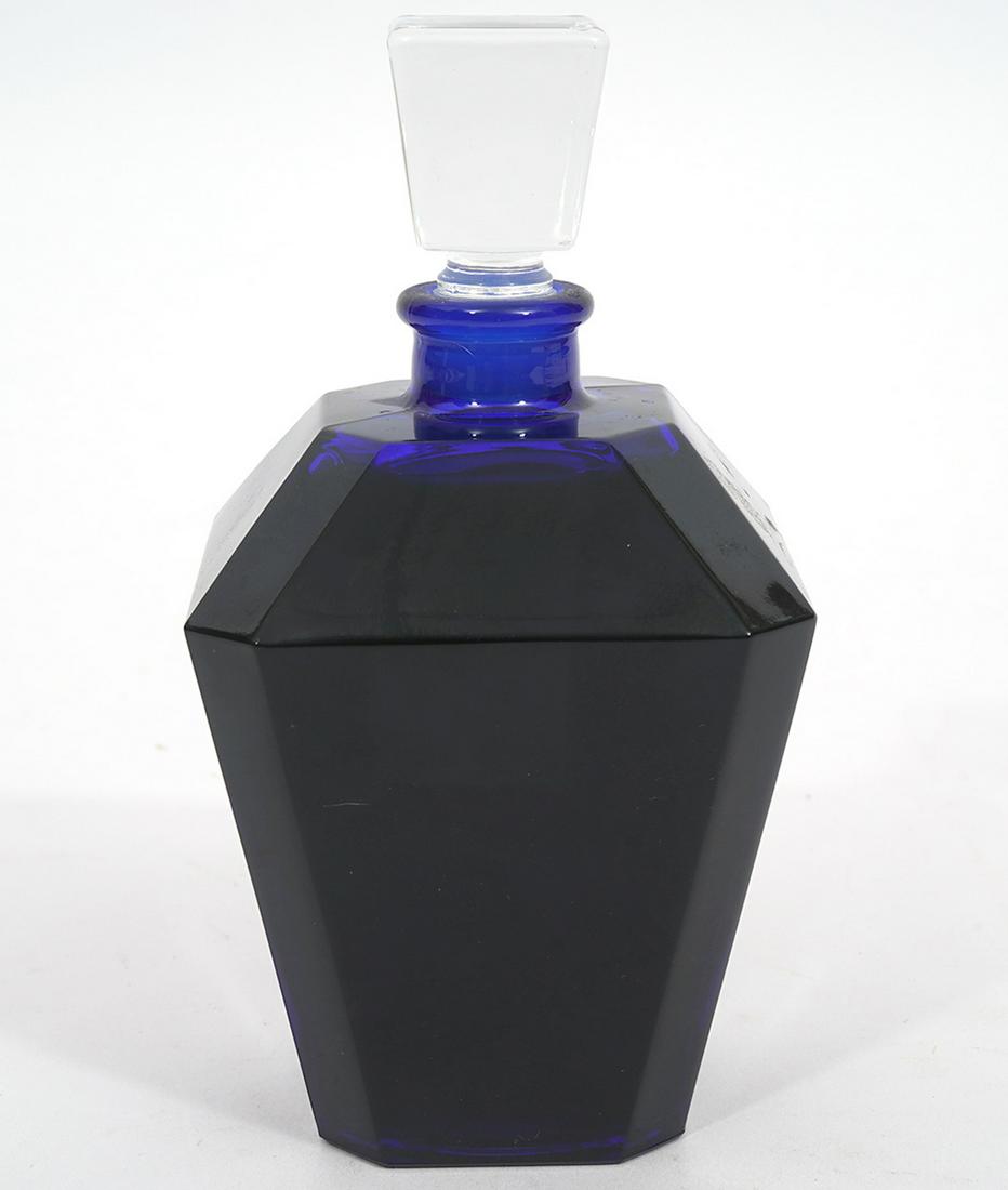 Rare Special Edition Guerlain 'Guet Apens' Perfume: Rare 'Guet Apens' Guerlain perfume by Mathilde Laurent, launched in 1999. Dark cobalt angled bottle, label on bottom, clear crystal stopper. Measures 4.5"H x 2.5"W x 2.5"D. Condition report: appears t