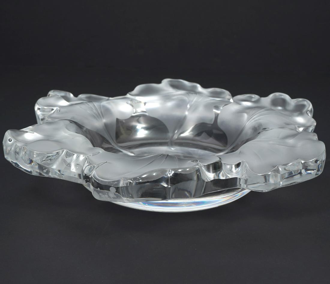 Lalique French Crystal "Capucines" Bowl: Lalique French crystal "Capucines" centerpiece bowl, features satin nasturtiums leaves. Signed underside. Measures 2.5"H x 12"W. Condition report: Minor scratches to underside, please examine all phot