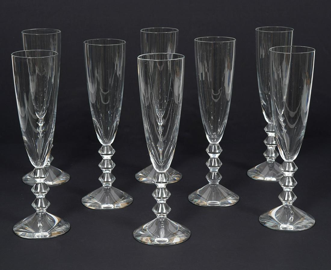 8 Baccarat Crystal "Vega" Champagne Flutes: Baccarat Crystal "Vega" champagne flutes. Set of 8. Each measures 9" H. Hallmarked underside. Condition report: Good condition, no issues, please examine all photos closely. Contact C. Biddle Auction 