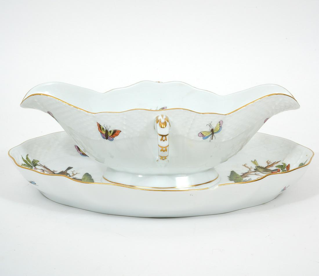 Herend 'Rothschild Bird' Gravy Boat: Herend Hungarian porcelain 'Rothschild Bird' gravy boat with scalloped gilt rim. Hallmarked underside. Measures 9.25"L x 4.5"W gravy boat; 10.5"L x 9"W underplate. Condition report: tiny chip to gilt 