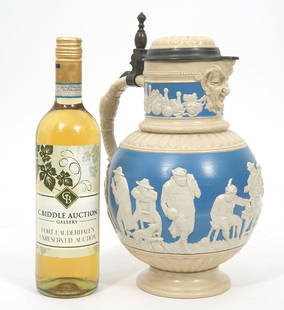 German Mettlach Ceramic Master Stein #2210: German Mettlach ceramic master stein, model #2210. Features relief tavern scene imagery all around. Marked underside. Measures 12"H x 8.5"W. Condition report: Good condition, no issues, please examine