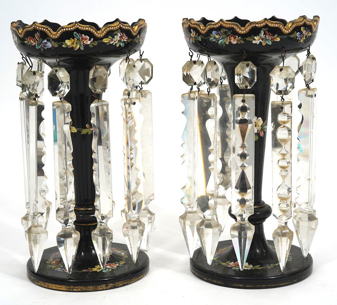 Pr. Bohemian Hand-Painted Mantle Lusters: Pr. Bohemian hand-painted mantle lusters with hanging crystals, features black glass and floral decoration. Measures 10"H x 5"W. Condition report: Minor paint loss and multiple chips to crystals, plea