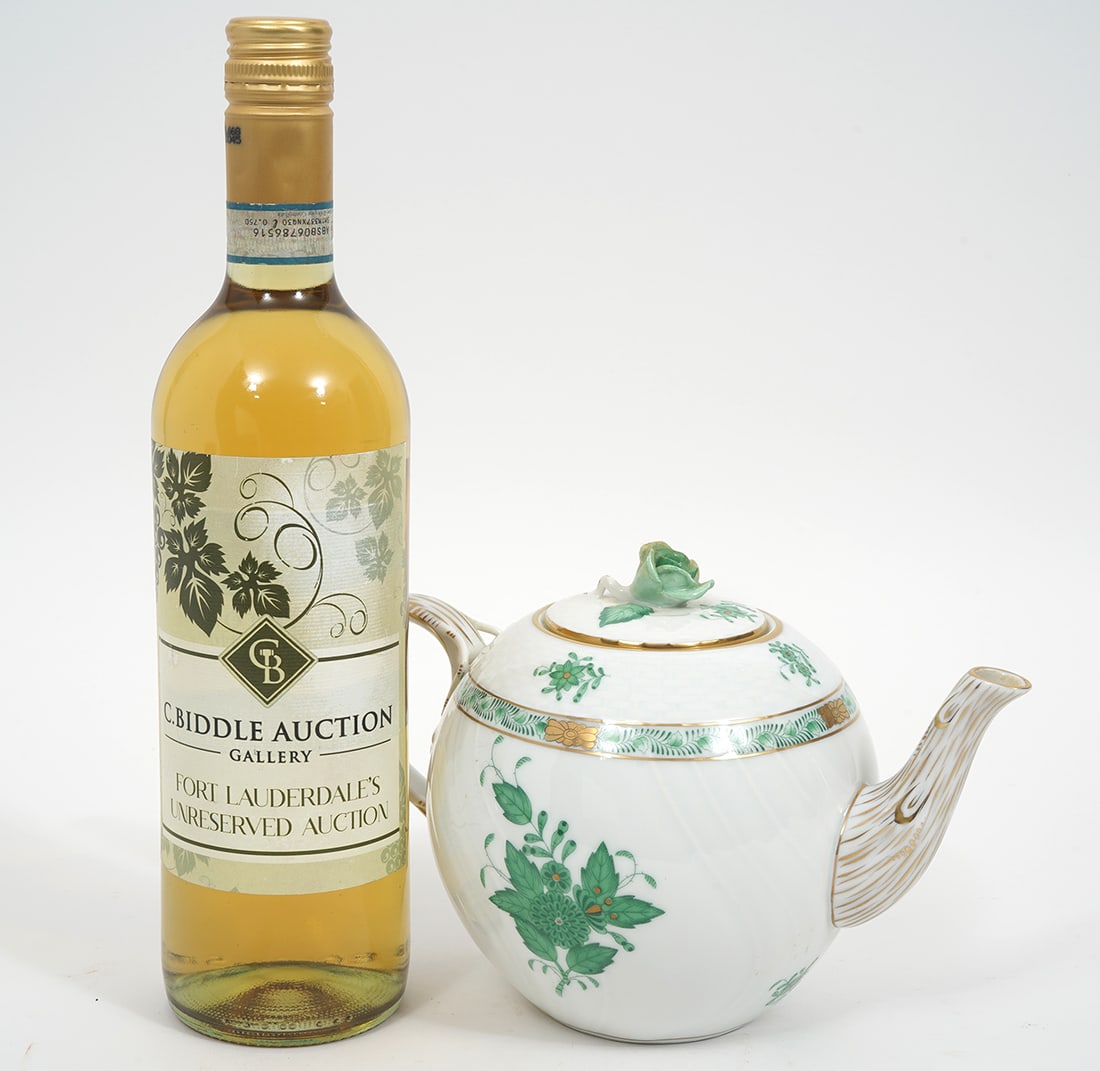 Herend Apponyi Green Porcelain Teapot: Herend "Apponyi Green" porcelain teapot with rose finial, branch handle and spout. Measures 6"H x 9"W. Condition report: Good condition, please examine all photos closely. Contact C. Biddle Auction Ga