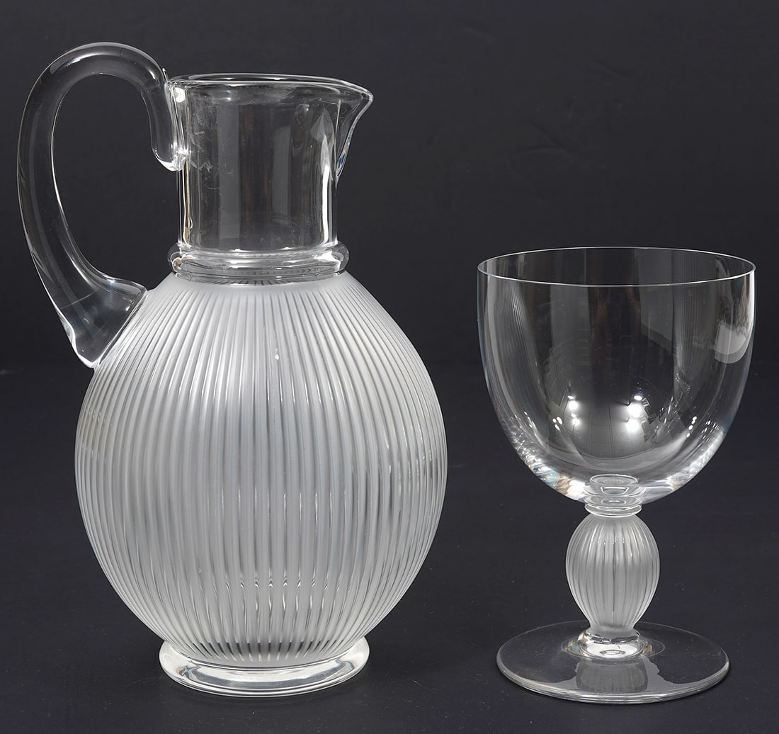 Lalique "Langeais" Pitcher and Wine Glass: Lalique "Langeais" French crystal pitcher (8.75"H x 5.5"W) and wine glass (5.25"H x 4"W). Features ribbed frosted and clear. Signed underside. Condition report: Good condition, please examine all phot