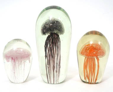 Three Art Glass Jellyfish Sculptures: Three art glass floating jellyfish sculptures with suspended bubbles, measuring 6.5", 7.5", and 9.5"H. Condition report: Minor chips at base, please examine all photos closely. Contact C. Biddle Aucti