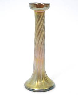 Louis Comfort Tiffany Favrile Twist Candlestick: Louis Comfort Tiffany Favrile twist form candlestick, signed underside. Measures 9.25"H x 3.25"W. Condition report: Good condition, please examine all photos closely. Contact C. Biddle Auction Gallery