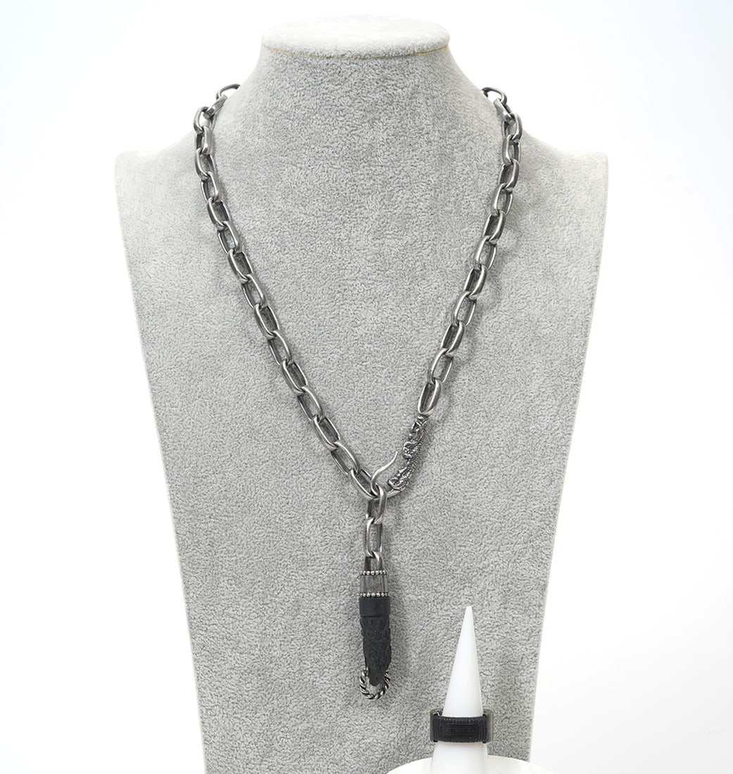 Diesel Men's Sterling Necklace & Steel Ring: Diesel Men's sterling link necklace with carved black eagle and claw clasp (25"L), weight -119.6g. Stainless steel and black fabric ring, size 9.5. Condition report: Good condition, please examine all