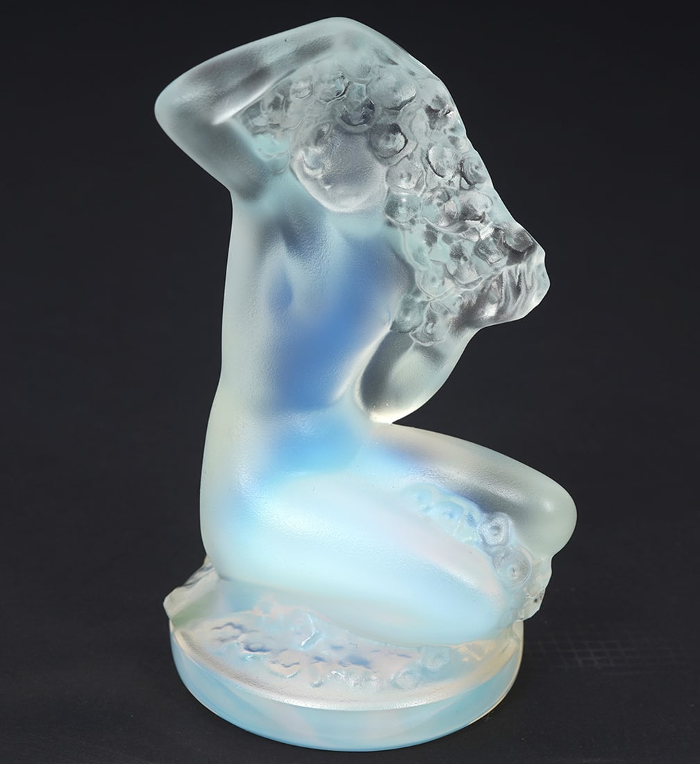 Lalique Opalescent Crystal Figural Paperweight: Lalique 'Floreal" opalescent glass figural paperweight of female nude. Signed on base. Measures 3.25"H x 1.5"W. Condition report: Good condition, please examine all photos closely. Contact C. Biddle A