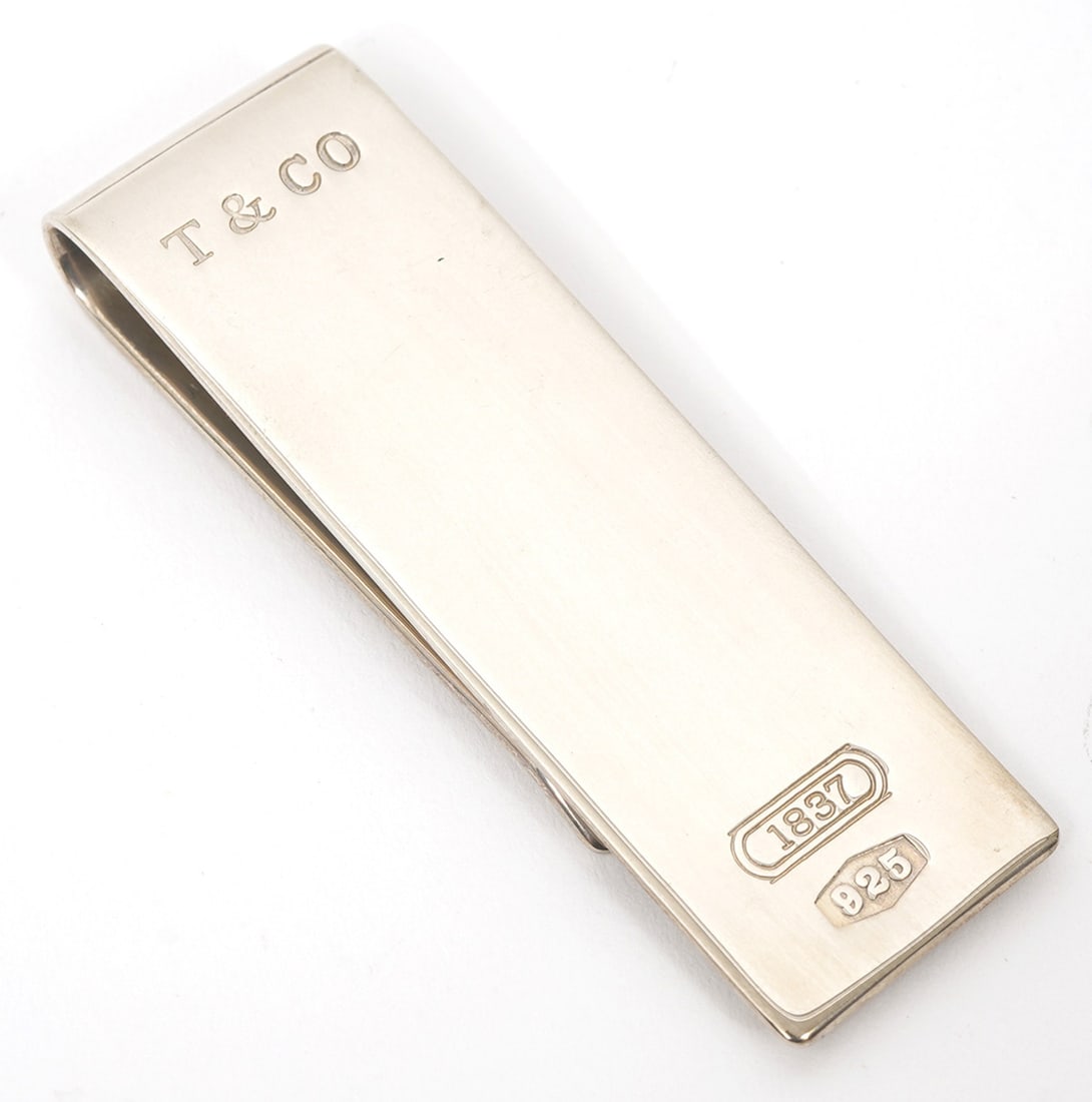 Tiffany & Co Sterling Silver Money Clip: Tiffany & Co sterling silver money clip, stamped "T & Co / 1837 /925" . Measures 18mm x 58mm. Weight - 22.3g. Condition report: Good condition, please examine all photos closely. Contact C. Biddle Auc