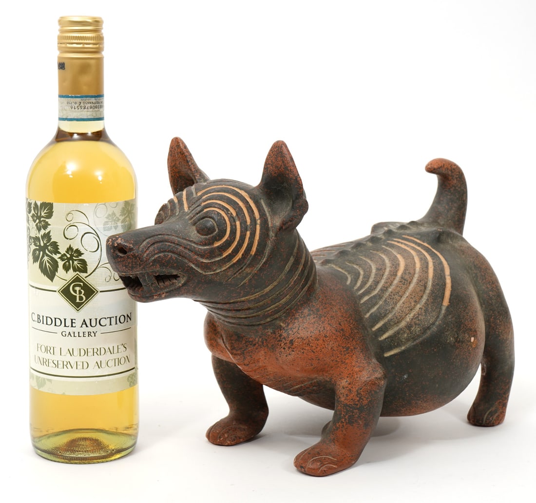 Pre-Columbian Style Mexican Colima Pottery Dog: Mexican Colima pottery dog in the style of pre-columbian ware. Features mottled red and black pattern with carved lines. 12.5"L x 7"W x 8"H. Condition report: Very minor surface wear, please examine a