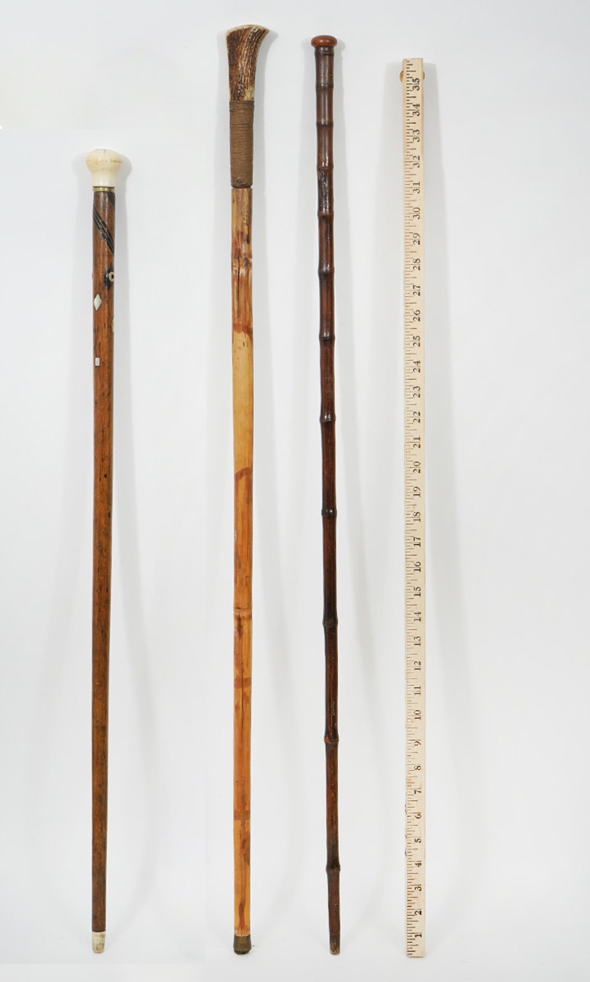 Group of Three Carved Wood Walking Sticks Canes (1 of 8)