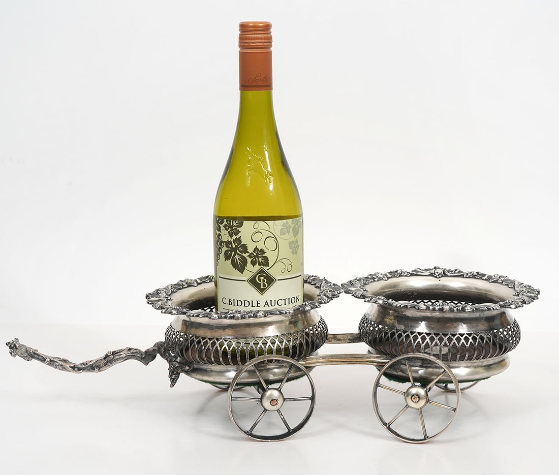English Silver-Plate Double Wine Trolly: English silver-plate on copper double wine trolly, features scrolling foliage rim and wood base and branch style handle. Made for W. Cowan of Chicago. Hallmarked on bottom edge. Measures 19"L x 8"W x 