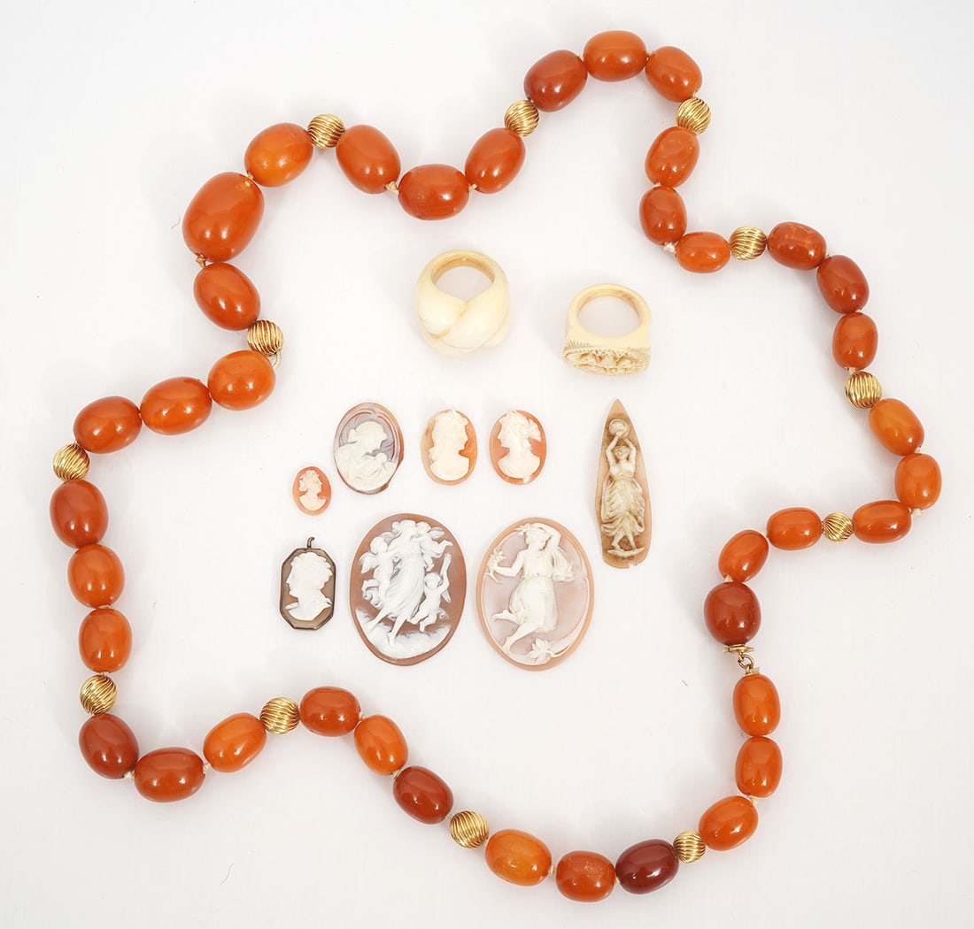 Amber Necklace, Carved Rings and Cameo Group: Lot includes: 30" amber bead (18 -9mm) necklace with 14k yellow gold spacers; Two carved bone rings; 8 assorted loose cameos (largest 1.25"); Condition report: Good condition, please examine all photo