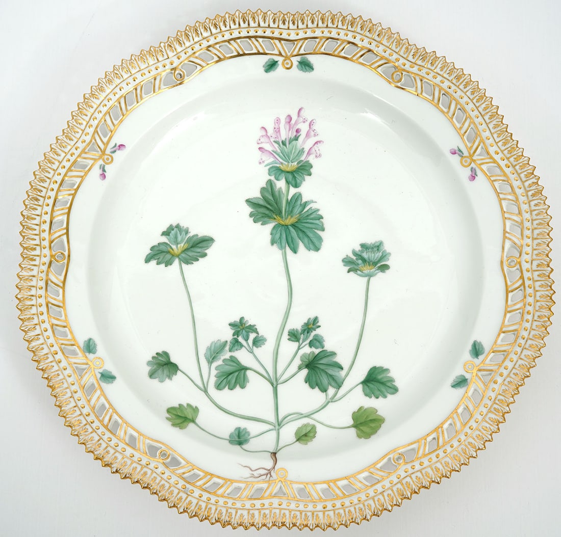 Royal Copenhagen "Flora Danica" Dinner Plate: Royal Copenhagen "Flora Danica" dinner plate (10.5"). Hand-painted with botanicals, pierced gilt border. Underside inscribed "Lamium Intermedium" with Royal Copenhagen mark. Condition report: Good con