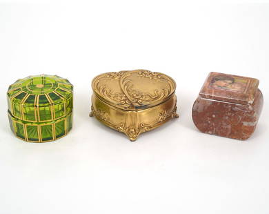 Three Jewelry / Trinket Boxes: Mixed group of three jewelry or trinket boxes includes a French round gilt green trinket box (2"H x 3"W); Edna Hibel pink marble stone box (2.75"H x 2"W x 2"H); Two hearts gilt metal with pink fabric