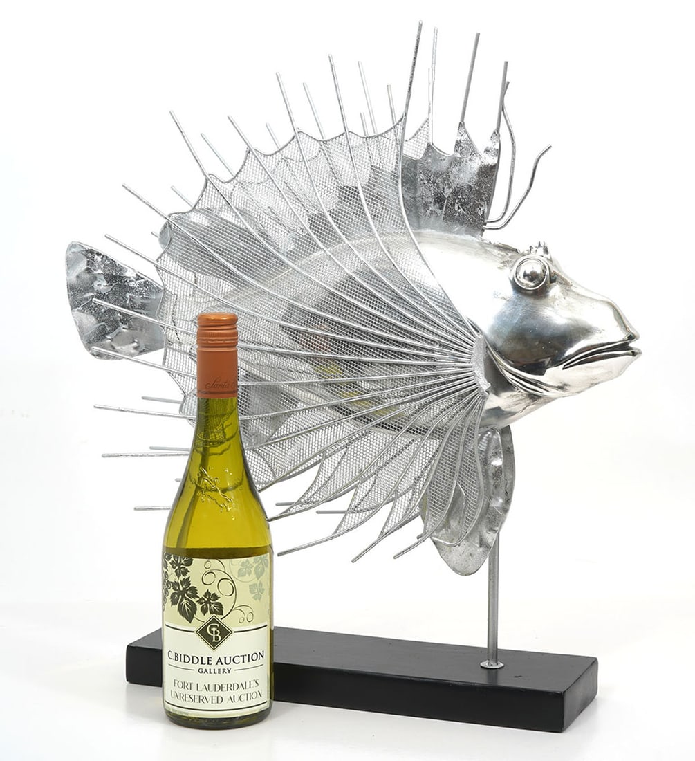 Decorative Silver Lionfish Sculpture: Decorative silver lionfish sculpture composed of metal and plaster. Measures 20"H x 18"W. Condition report: Good condition, please examine all photos closely. Contact C. Biddle Auction Gallery for mor