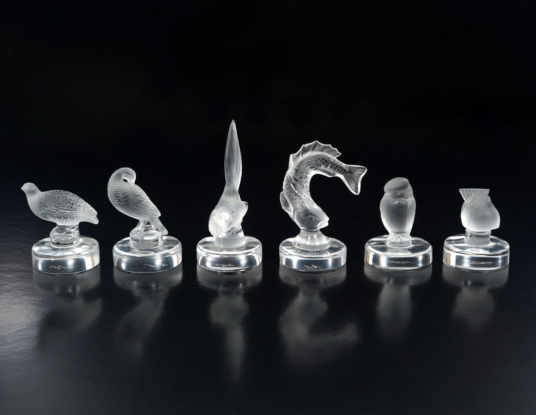 6 Lalique Moulded Frosted Glass Place Card Holders: 6 Lalique France moulded frosted glass place card holders, each with a different figural bird or fish. Range in size from 1.75" to 4.25"H. Signed underside. Condition report: Good condition, please ex