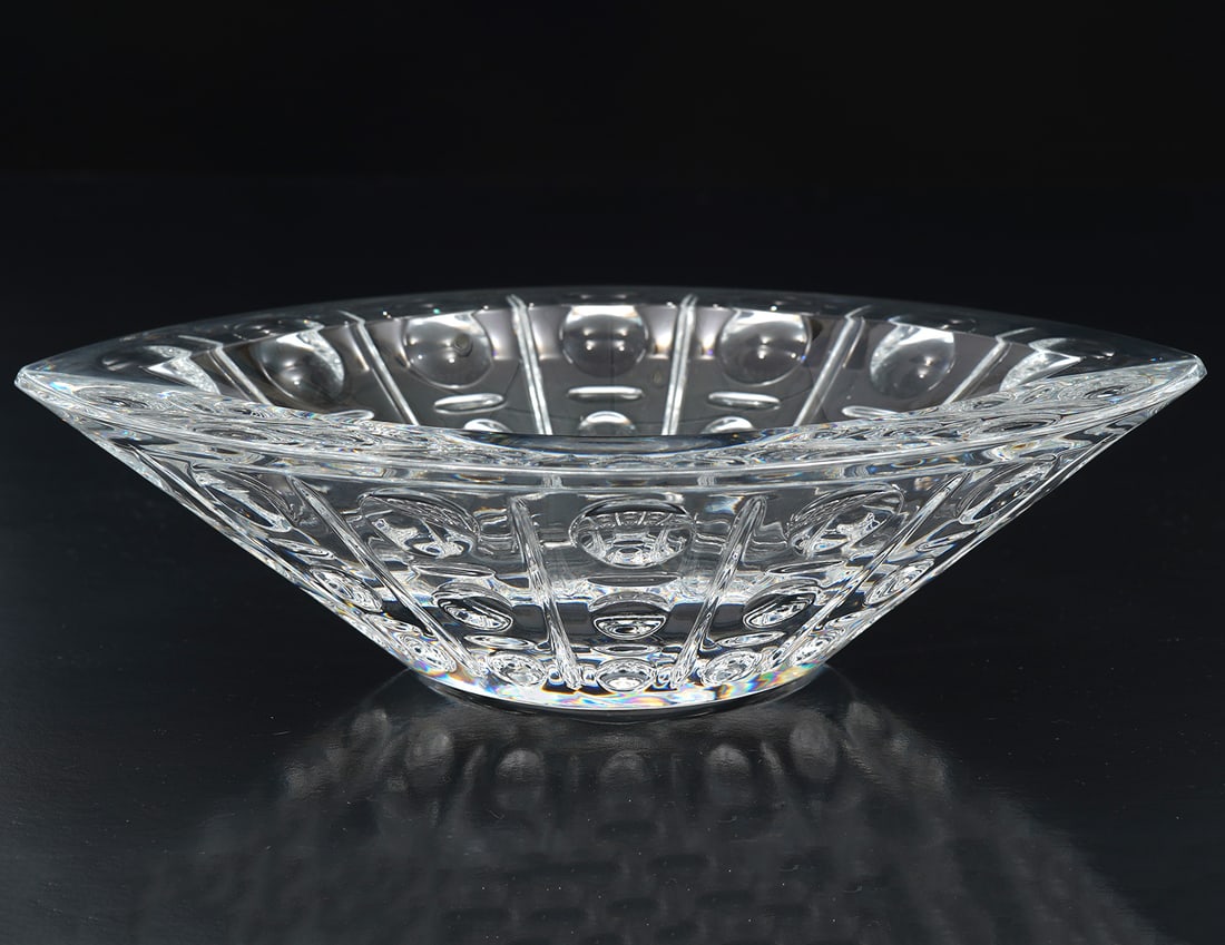 Baccarat Crystal 'Equinoxe' Bowl: Baccarat French crystal 'Equinoxe' bowl or ashtray, features eclipse form with alternating dot and line cut-outs. Measures 7"L x 5.5"W x 2"H. Condition report: Good condition, please examine all photo
