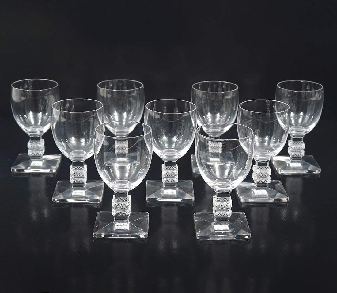 9 Lalique French Crystal "Argos" Cordial Glasses: 9 Lalique French crystal "Argos" cordial glasses, signed underside. Measures 3.5"H x 1.75"W. Condition report: Good condition, please examine all photos closely. Contact C. Biddle Auction Gallery for 