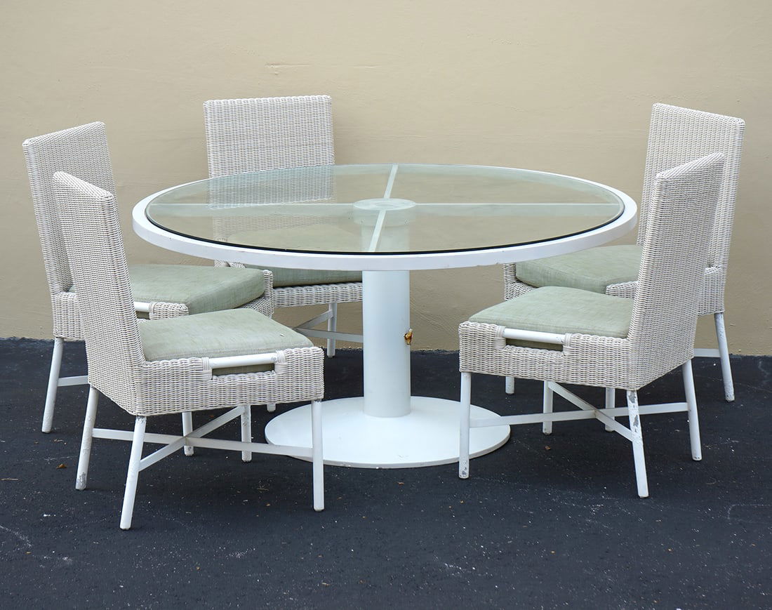 Thomas Pheasant for McGuire Outdoor Dining Set: Thomas Pheasant for Baker/McGuire, outdoor dining set includes five chairs (24L x 24"W x 36"H) and round glass top table (28"H x 60"W). Composed of metal and resin. Condition report: Wear commensurate