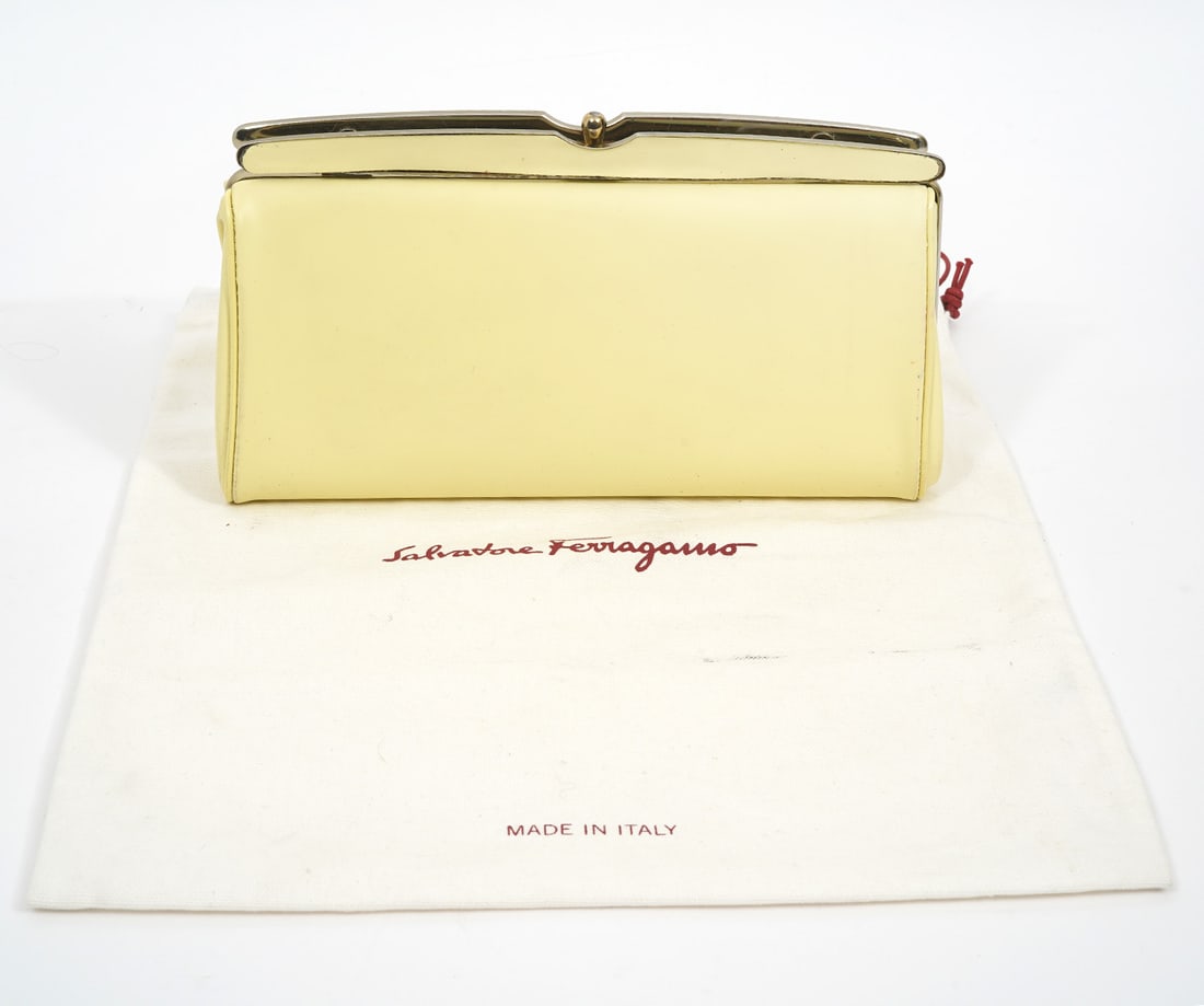 Salvatore Ferragamo Clutch: Salvatore Ferragamo Italian patent leather clutch with handle. Includes dust bag. Measures 9.5"L x 5.25"W. Condition report: Some minor signs of wear from use, please see all photos. Contact C. Biddle