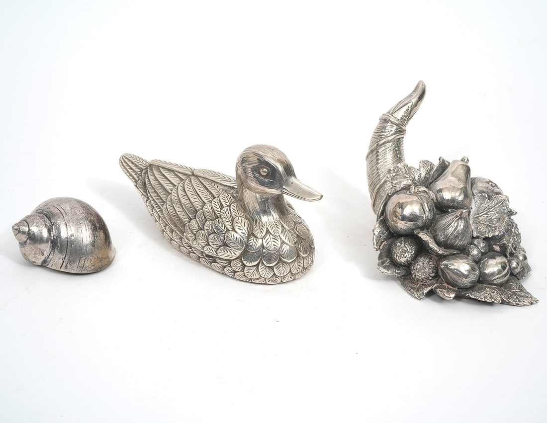 Three Silvered Decorative Objects: Three silvered decorative objects includes a Duck (2.5"H x 5.5"W), Cornucopia (2.5"H x 4.75"L), and Shell (1"H x 1.5"W). Condition report: Good condition, please see all photos. Contact C. Biddle Auct