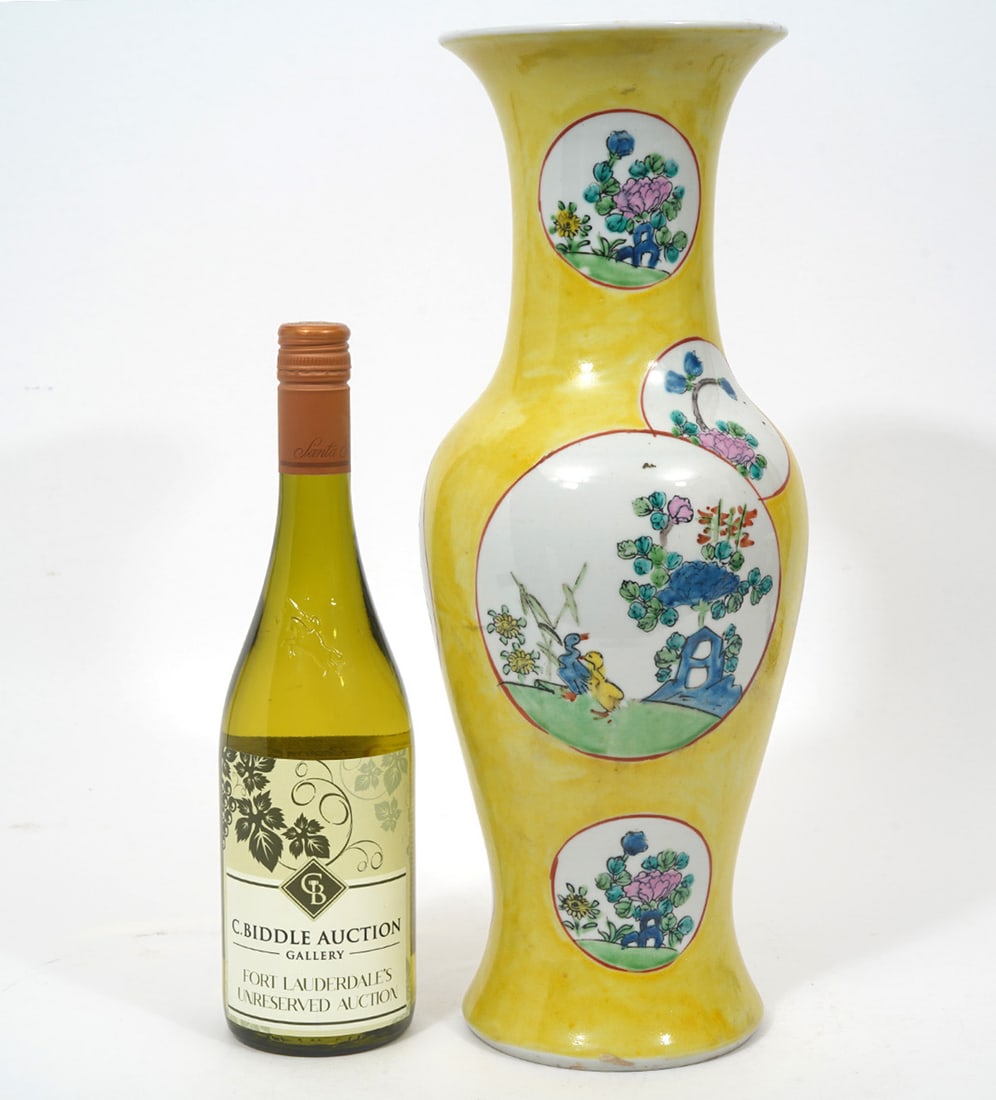 Chinese Yellow Ground Phoenix Tail Vase: Chinese yellow ground phoenix tail vase features circular vignettes of floral scenes. Measures 16.5"H x 6"W. Condition report: Good condition, please see all photos. Contact C. Biddle Auction Gallery 