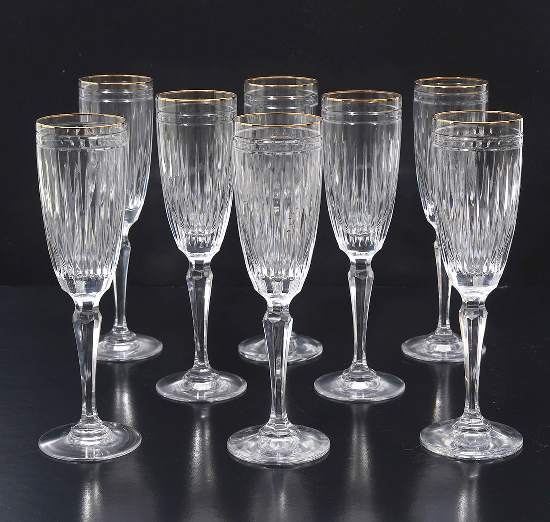 8 Waterford Crystal Hanover Gold Champagne Flutes: 8 Waterford Marquis Hanover Gold Champagne Flutes with ribbed bodies and gold trimmed rims. Measures 8.75"H. Condition report: good condition, please see all photos. Contact C. Biddle Auction Gallery 