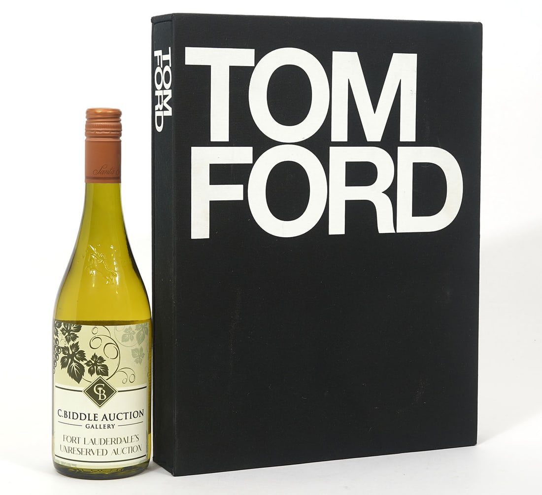 Tom Ford Slip Cover Edition Hardcover Book: Tom Ford hardcover book with slipcover. Measures 14.75"H x 11.25"W. Condition report: Good condition, please examine all photos closely. Contact C. Biddle Auction Gallery for more detailed information
