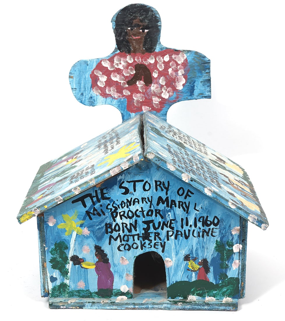 Mary L. Proctor Painted Wood Church Sculpture: Mary L. Proctor, American (Born 1960). Painted wood sculpture of a church with a painted life story. Signed on front in a story. Measures 15" H x 12.5" W x 11" D. Condition report: Wear to paint, some