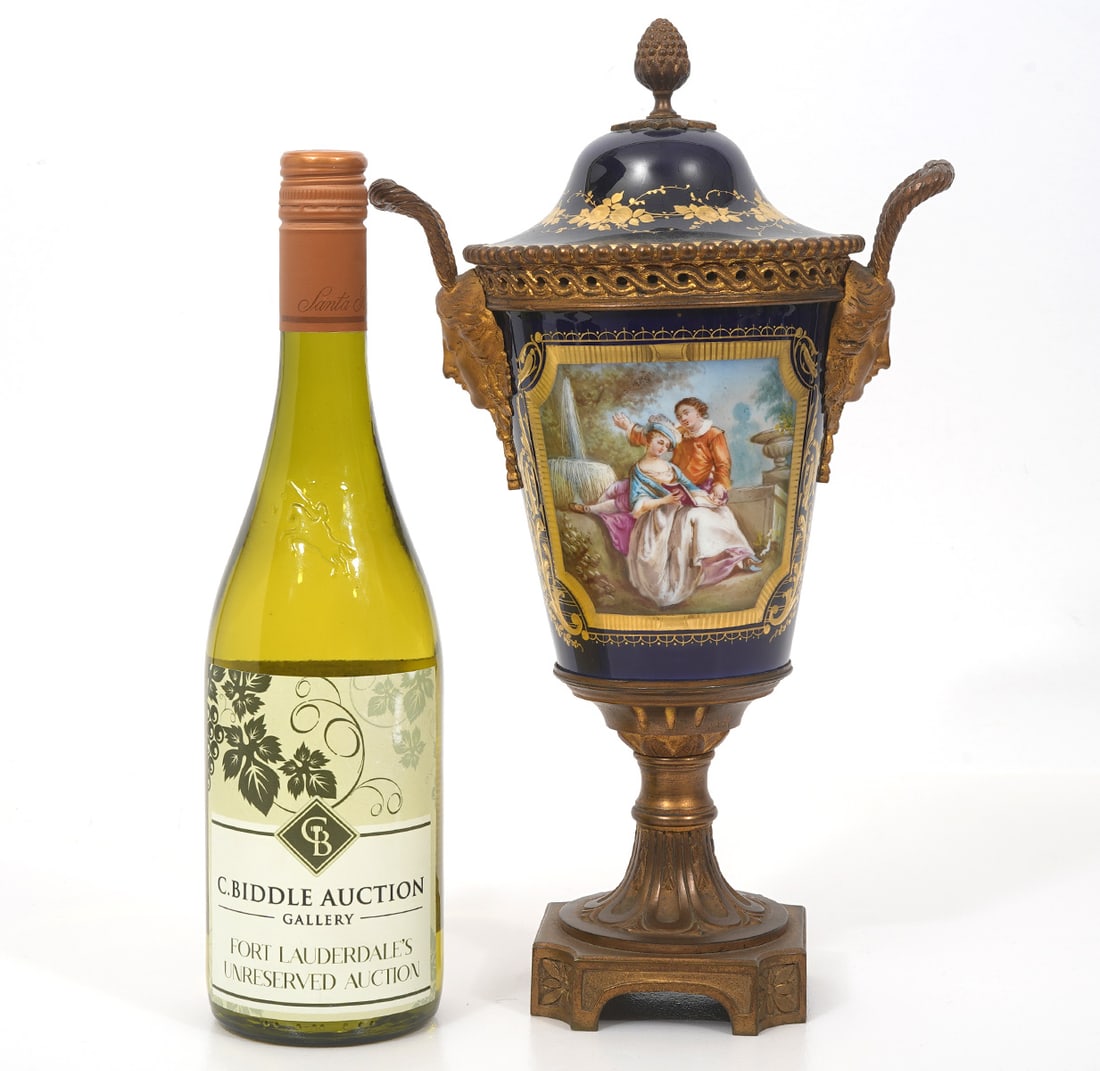 Sevres Porcelain and Bronze Mounted Lidded Urn: Hand painted Sevres porcelain and bronze mounted lidded urn. Signed on underside of lid. 14" H x 8" W x 6" D. Condition report: normal wear, no breaks or repairs. Please examine all photos closely. Co