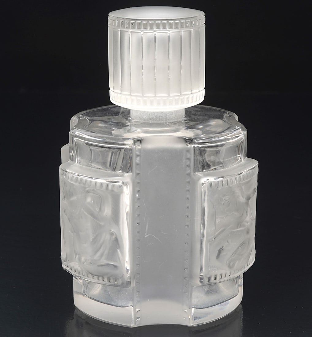 Lalique 'Helene' Perfume Bottle: Lalique Perfume Bottle 'Helene' frosted container with blown out rectangular panels depicting early Greek style motifs with matching column type covers and ribbed cap. Marked on underside 'Lalique Fra