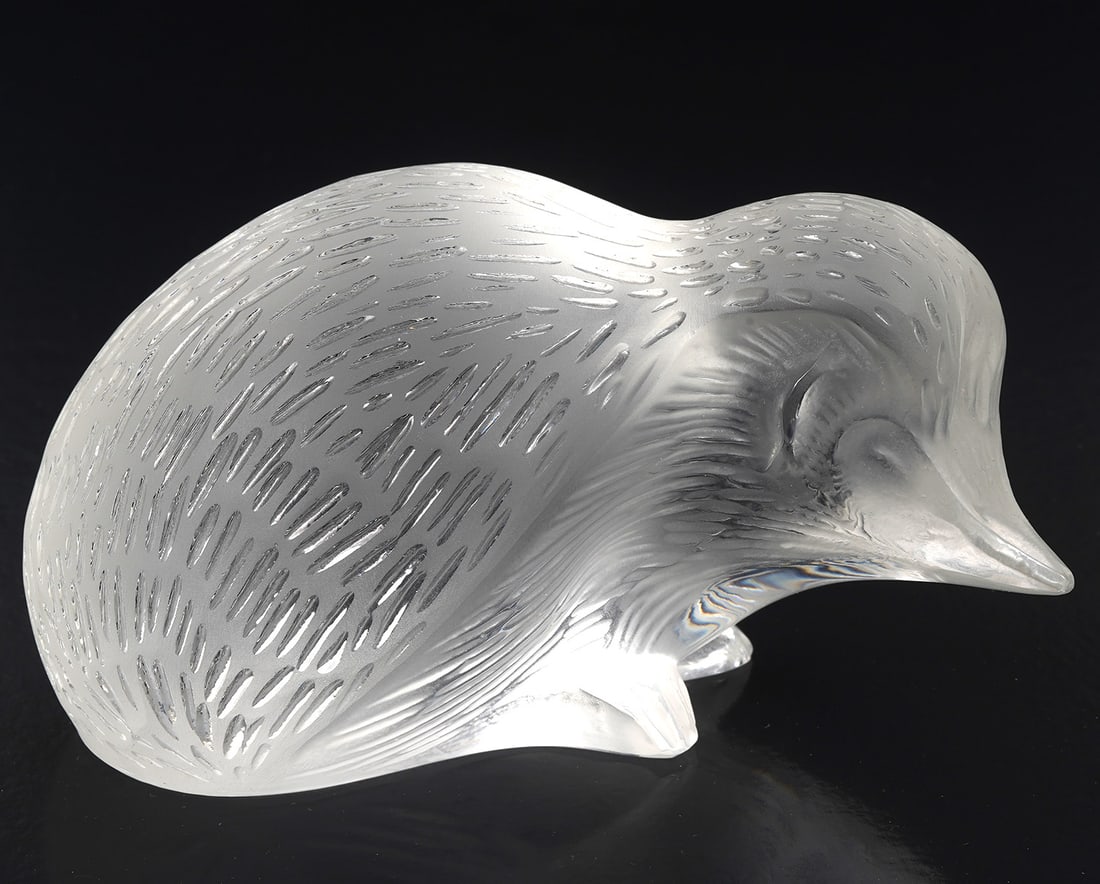 Lalique French Crystal Hedgehog Figure: Lalique French crystal hedgehog figure, signed at base. Measures 3"H x 5"W. Condition report: Good condition, please see all photos. Contact C. Biddle Auction Gallery for more detailed information. C.