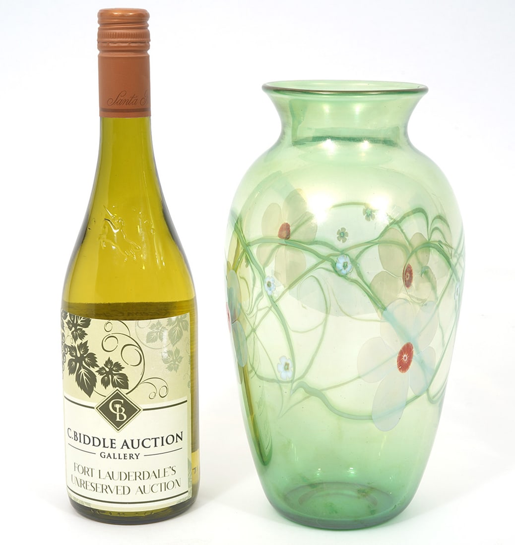 Orient & Flume Opaque Green Floral Vase: Orient & Flume opaque green vase, features flowers and vines. Signed underside. Measures 10"H x 5.5"W. Condition report: Good condition, please examine all photos closely. Contact C. Biddle Auction Ga