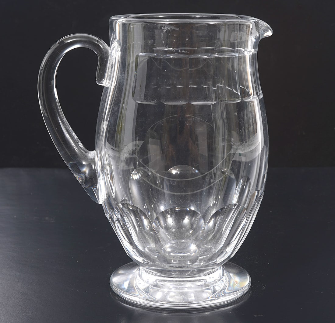 Baccarat France Cut Crystal Pitcher: Baccarat France cut crystal pitcher features square and rounded sided cuts. Measures 7.5"H x 6.5"W. Condition report: Good condition, please examine all photos closely. Contact C. Biddle Auction Galle