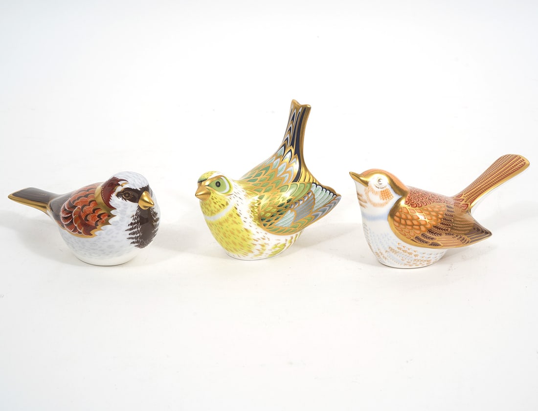 3 Royal Crown Derby Bird Paperweights: 3 Royal Crown Derby bird paperweights in bone china with gold stoppers on the underside indicating best quality. Lot consists of a 'Green Finch' (3.5"H x 4"L x 2"W); Nightingale (2.5"H x 5"L x 2"W); H