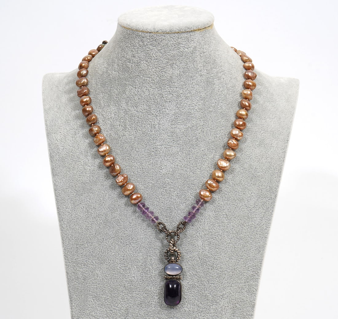 Sterling Bronze Pearl Amethyst Moonstone Necklace: Sterling silver, bronze, pearl, amethyst and moonstone necklace. Features cabochon bezel set amethyst and moonstones accented with silver wire loop. Bronze saltwater pearls and faceted amethyst beads 