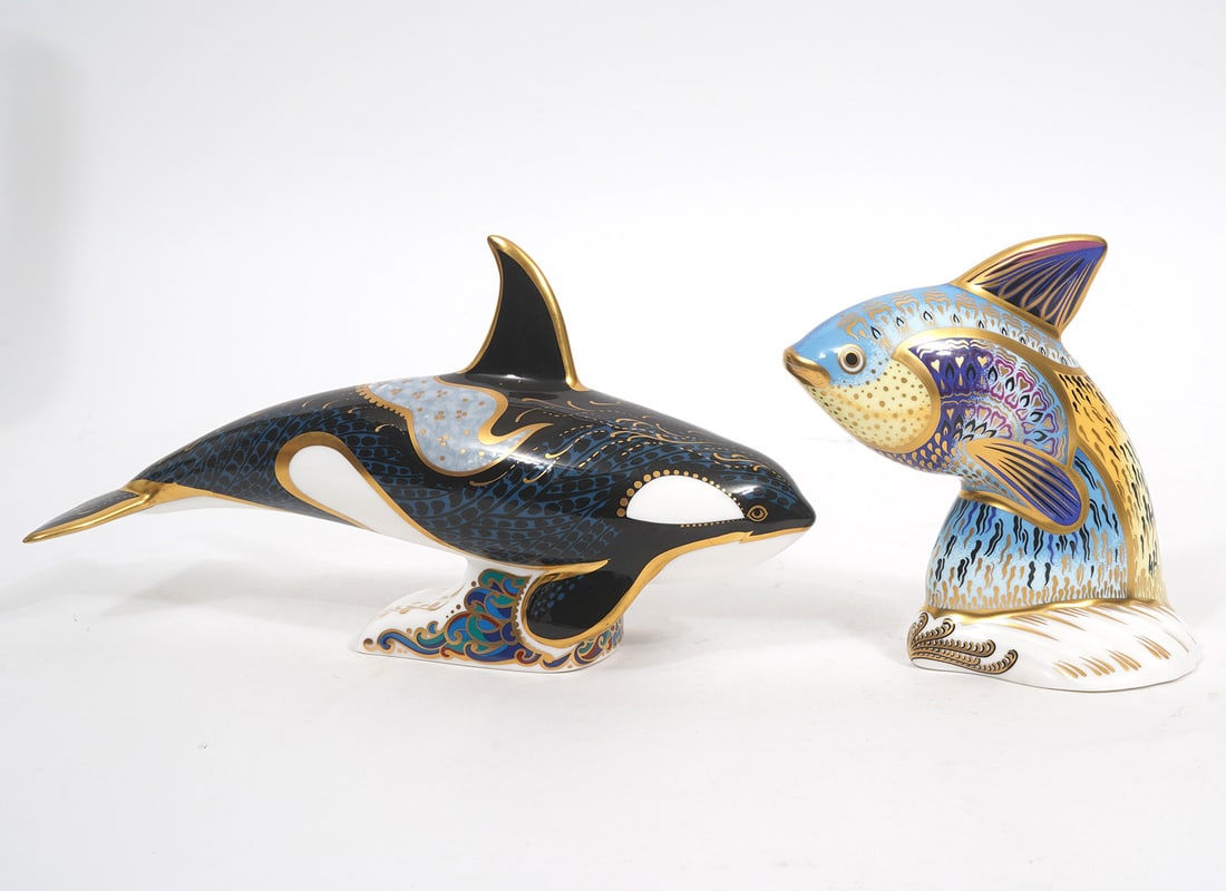 Royal Crown Derby Fair Isle Orca & Guppy Fish: Royal Crown Derby 'Fair Isle Orca' paperweight in bone china has gold stopper on underside indicating best quality and measures 9"L x 5"H x 2.75"W. Bone china 'Guppy Fish' paperweight also has gold st