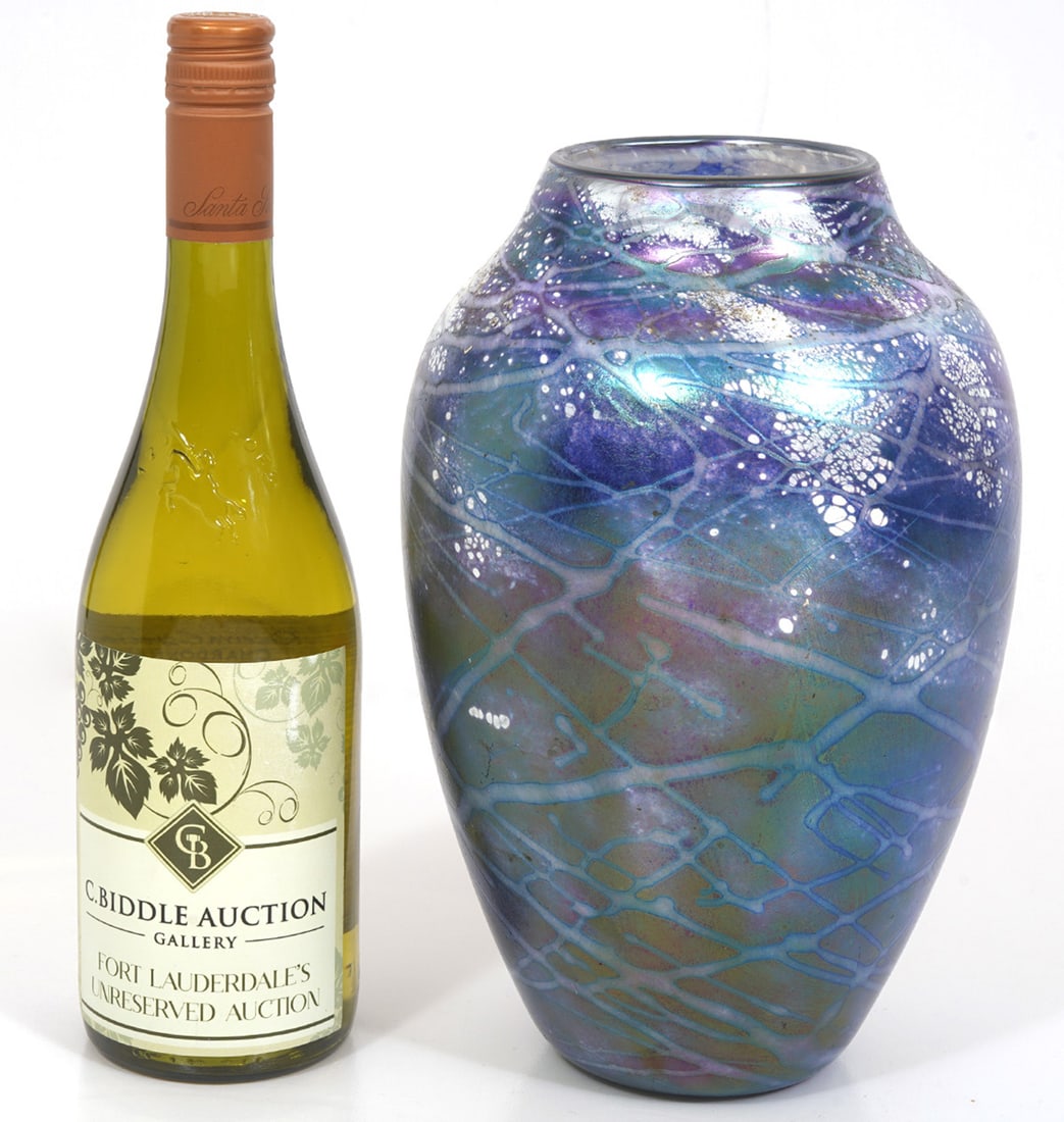 Tom Stoenner Iridescent Blue Art Glass Vase: Tom Stoenner, Hudson Valley artist, art glass vase features iridescent blue drip pattern with white patches and is signed underside and dated 1997. Measures 10.5" x 6.5"W. Condition report: Good condi