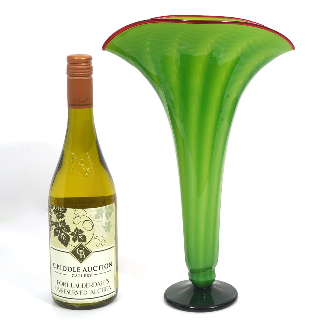 Molly Stone Signed Green Fan-Shaped Vase: Molly Stone signed fan-shaped vase with green body and red rim, pedestal foot. Measures 13"H x 9"W. Condition report: Good condition, please examine all photos closely. Contact C. Biddle Auction Galle