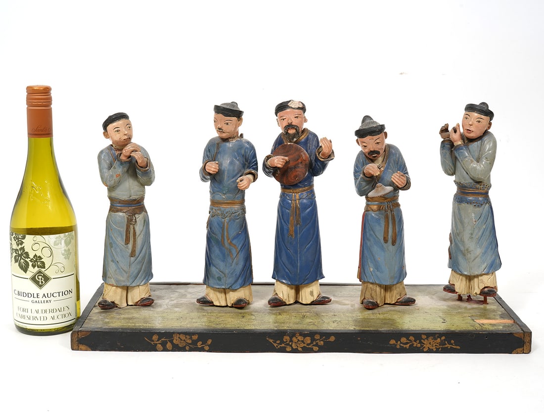 Terracotta Sculptures of 5 Asian Figures: Terracotta sculptures of 5 Asian figures with detachable heads dressed in similar robes and mounted on a wood base. Figures measure 9.5"H; wood base 20 5/8"L x 7 5/8"W x 1"H. Condition report: chips a
