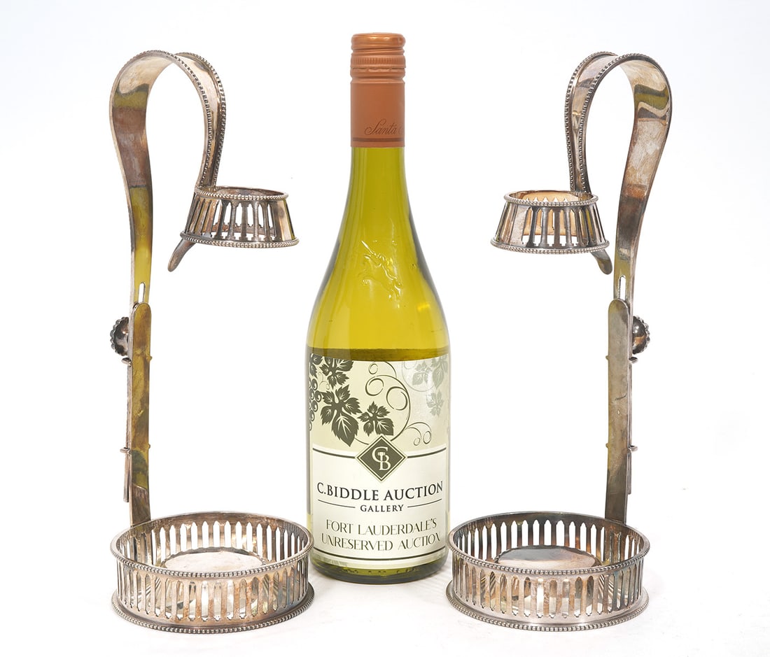 Pr. Silver plate Vintage Wine Bottle Holders: Pair of silver plate vintage wine bottle adjustable holders have rounded tops with beaded trim and a floral knob to adjust the height, circular rim that the neck of the bottle fits into and a circular