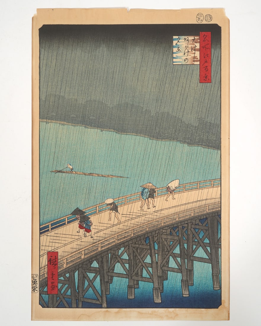 Utagawa Hiroshige "Sudden Shower" Woodblock: Utagawa Hiroshige "Sudden Shower Over Shin Ohashi Bridge" Japanese colored woodblock, unframed. Measures approx. 14.5"H x 9"W. Condition report: Foxing and edge wear throughout, please examine all pho