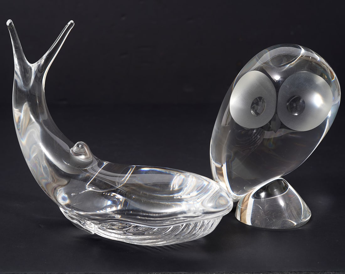 Steuben Owl & Kosta Whale Signed Glass Figures: Steuben signed modernist-style owl (5.5"H x 3.75"W ), Kosta whale (6"H x 7.5"W). Condition report: Good condition, please examine all photos closely. Contact C. Biddle Auction Gallery for more detaile