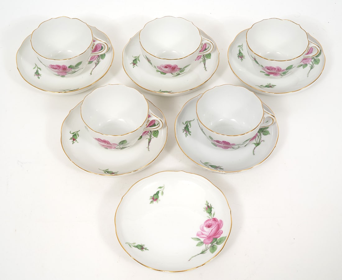 Meissen 'Pink Rose' Porcelain 5 Cups & 6 Saucers: Meissen 'Pink Rose' porcelain group Includes - 5 cups and 6 saucers. Measures 5.5"W saucers; 4.25"W cups Blue crossed swords mark underside. Condition report: Good condition, please examine all photos