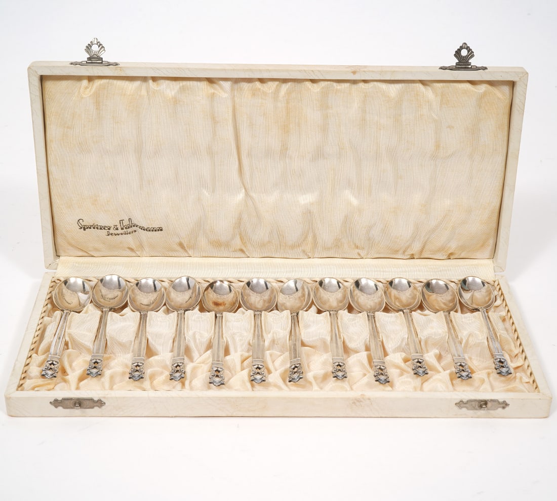 Set of 12 Georg Jensen Acorn Demitasse Spoons: Set of 12 cased Georg Jensen demitasse spoons, each measures approx 3.75" long. Hallmarked underside neck of spoons. Total Weight - 137.6g. Condition report: Good condition, please examine all photos 
