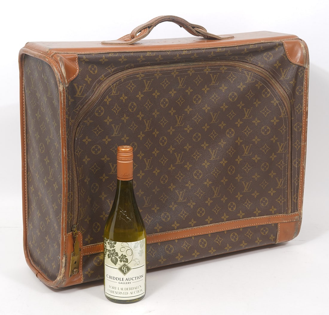 Louis Vuitton Monogram Travel Luggage: Louis Vuitton monogram travel luggage, with zipper front. Measures 23"L x 7"W x 20"H. Condition report: Good condition, please examine all photos closely. Contact C. Biddle Auction Gallery for more de