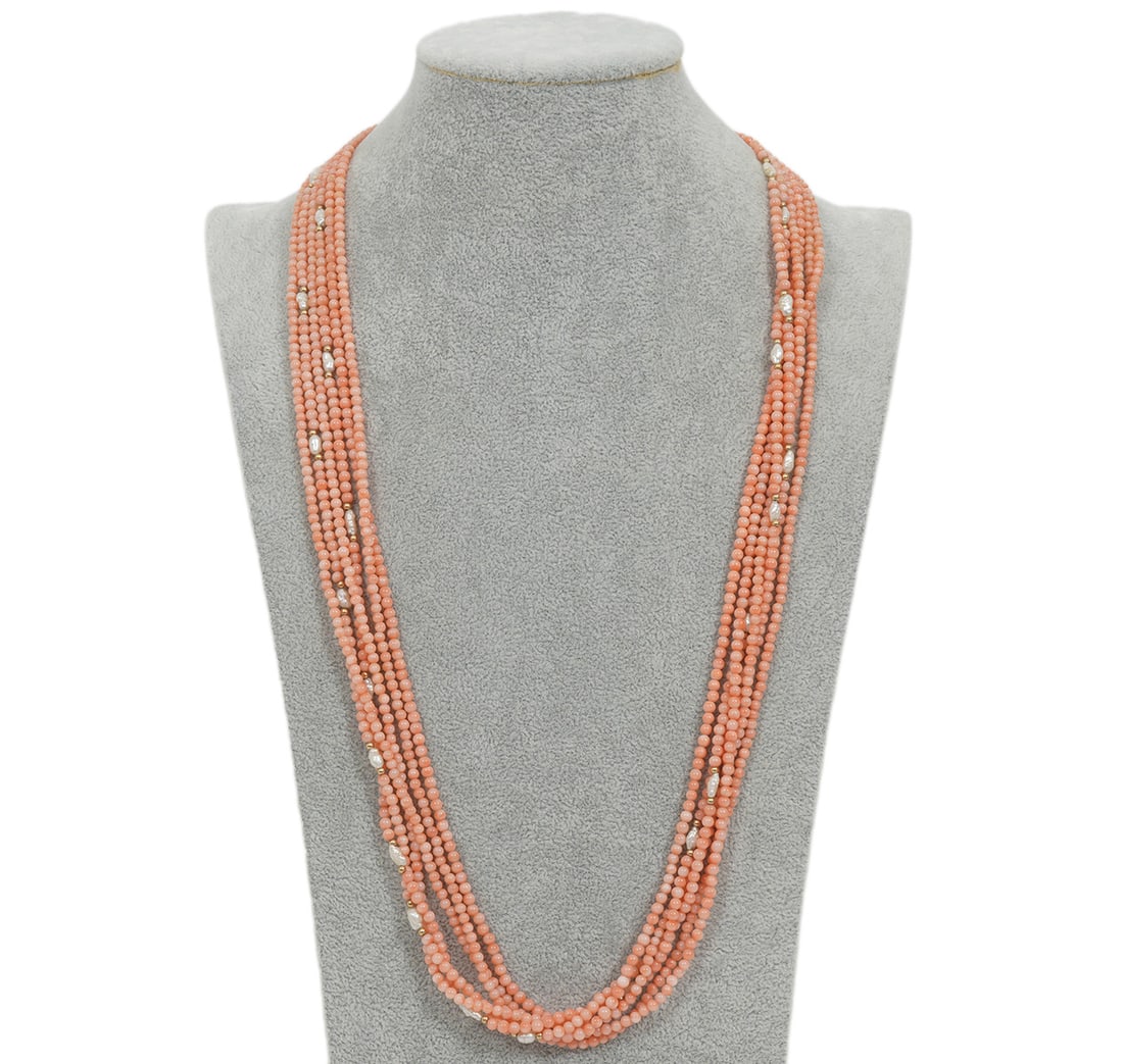 14K YG 6 Strand Angelskin Coral & Pearl Necklace: 14K yellow gold 6 strand natural angelskin coral and pearl necklace showcasing 6 strands of 3.5mm each coral beads interspersed with rice size pearls and gold beads. This is completed with a 15 x 22mm